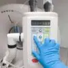 Medical personnel activating ventilator