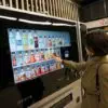 Woman at vending machine